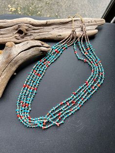 This is a gorgeous Native American Navajo 5 strand handstrung necklace. The Artist is A Tallis, this beauty is 24.5" of materials, if you include the tie backs 35.5" is the length end to end. It's made from natural Turquoise, Mediterranean Coral and Shell Heishi.  This is a lovely necklace to add to your  jewelry collection, or to give as a wonderful gift for a friend!! *Please look at all photos closely. Thanks for dropping by          NorthWestTradinCo Turquoise Multi-strand Hand-strung Jewelry, Multi-strand Turquoise Necklace For Jewelry Making, Multi-strand Turquoise Gemstone Beads Necklace For Jewelry Making, Southwestern Multi-strand Turquoise Jewelry, Hand-strung Multi-strand Turquoise Necklace Gift, Southwestern Multi-strand Turquoise Beaded Necklace, Southwestern Multi-strand Turquoise Gemstone Necklace, Hand-strung Multi-strand Bohemian Turquoise Necklace, Bohemian Multi-strand Hand-strung Turquoise Necklace