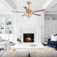 a living room filled with furniture and a fire place in the middle of the room