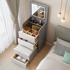 the drawers are open on top of each other in this small room with a bed