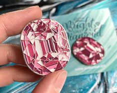 Shine bright like a diamond! A pink Tourmaline enamel pin is a perfect little gift.  Add some shine to your outfit! Pins will look best on hats, tote bags, and collars. Gem pin makes clothing and stuff look stylish. Pins are made with top-quality enamel and have a silver-toned polished metal finish. The colors of the enamel are bright and clean. 1.2 inch wide, 1.37 inch high.   Gem pins will be placed on the illustrated backing card. Gem design is made from my own illustration. Silver Enamel Lapel Pin Gift, Pink Enamel Pin For Gifts, Pink Enamel Pins As Gifts, Pink Enamel Pins For Gifts, Pink Enamel Pins As Gift, Pink Brooch For Valentine's Day Gift, Pink Brooches For Valentine's Day Gift, Rose Gold Brooch Pins For Gifts, Enamel Brooch Lapel Pin Gift