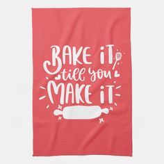 a red towel with the words bake it, tell you make it