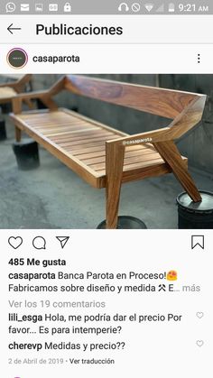 a wooden bench sitting on top of a cement floor