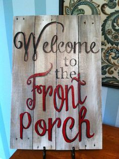 a wooden sign that says welcome to the front porch