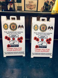 two signs with the names of veterans and thank you for your support in front of an american legion sign