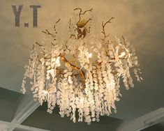 a chandelier hanging from the ceiling in a room