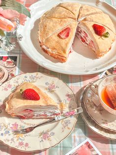 there is a piece of pie on the plate next to a cup and saucer