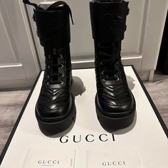 Black Lifford Charlotte Gucci Boots In Leather With Logo On Band. Brand New, Comes With Box, Dust Bags And Shopping Bag. Please Note Size 37 But Fits 7.5, Runs Large Gucci Luxury Ankle Boots, Gucci Designer Ankle Boots, Designer Gucci Ankle Boots, Gucci Luxury Round Toe Boots, Gucci Luxury Boots With Round Toe, Black Gucci Boots With Branded Heel, Gucci Designer Black Boots, Luxury Gucci Boots With Round Toe, Designer Black Gucci Boots