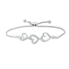 1/20 CT. T.W. Diamond Triple Heart Bolo Bracelet in Sterling Silver - 9.5" | Silver and Diamonds | Collections | Zales Outlet Elegant Adjustable Open Heart Jewelry, Elegant Adjustable Open Heart Bracelet, Adjustable Heart-shaped Diamond Jewelry, Elegant Adjustable Sterling Silver Heart Bracelet, Sterling Silver Heart Bracelet With Adjustable Chain For Anniversary, White Gold Heart Bracelet For Anniversary, Adjustable Diamond Accent Bracelet For Anniversary, Adjustable Diamond Accented Bracelet For Anniversary, Adjustable Diamond Heart Bracelet For Valentine's Day