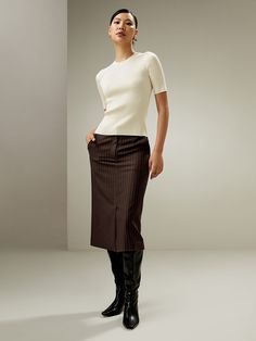 Elevate your style with this high-waisted pencil skirt crafted from a wool-silk blend tweed, featuring a front slit, concealed zip fastening, and silk lining. Perfect for a sophisticated and professional look during all seasons. Airport Outfits, Midi Pencil Skirt, High Waisted Pencil Skirt, Midi Skirt Pencil, Professional Look, Airport Outfit, Winter Dresses, Concert Outfit, Winter Wedding