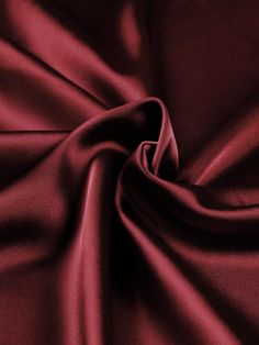 Indulge in the luxurious feel of this 58"/60" wide (147/152 cm) Silk Skin Duchess fabric, also known as Peau de Soie. Its dull satin finish and lightweight drape make it a perfect choice for creating elegant bridesmaid dresses, formal gowns, or any special occasion attire. With a subtle sheen and smooth texture, this high-quality silk fabric offers a sophisticated look and feel. Whether you're a professional dressmaker or an avid sewing enthusiast, this versatile material will elevate your projects with its timeless beauty and exceptional craftsmanship. Elevate your sewing experience and create stunning garments that will turn heads with this premium Silk Skin Duchess fabric. Luxurious Fabric: Crafted from exquisite peau de soie silk, this fabric offers a dull satin finish and a smooth, su Deep Red Fabric, Luxury Solid Satin Tie, Burgandy Bridesmaids Dresses, Burgandy Bridesmaids Dress, Satin Aesthetic, Duchess Fabric, Red Satin Fabric, Bridesmaid Dresses Formal, Burgundy Fabric