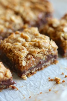 two pieces of oatmeal and peanut butter bars stacked on top of each other