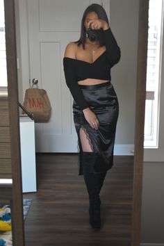 Mirror selfie wearing Black Criss-Cross Crop Top with Satin Black Skirt with Slit and Lace Detail and Thigh High Boots Combat Boots Satin Skirt, Thigh High Black Boots Outfit, Thigh High Boots With Skirt, Satin Black Skirt Outfit, High Black Boots Outfit, Simple Date Night Outfit, Thigh High Black Boots, Outfit Modest, Black Skirt Outfits