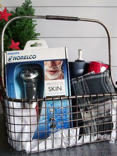 a basket filled with personal care items on top of a counter next to a christmas tree