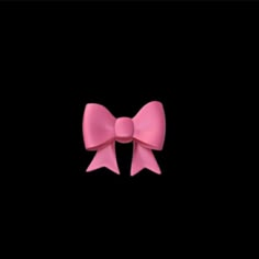 a pink bow on a black background