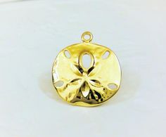 This vermeil sand dollar charm measures about 18mm in diameter. It is perfect for bracelet, necklace and earrings. It is 18k gold plated over 925 sterling silver (vermeil), shiny  gold.925 stamped in the back.1 pc.silver version: Listing: http://www.etsy.com/listing/114478741/925-sterling-silver-oxidized-sand-dollarmatte vermeil version: Listing: http://www.etsy.com/listing/150706144/vermeil18k-gold-over-925-sterling-silverFor the larger quantity convo us.Thanks for stopping by! Large Mermaid, Irish Claddagh, Gold Sand, Shades Of Gold, Sand Dollar, Sea Life, 18k Gold, Gold Plate, Etsy Gift Card