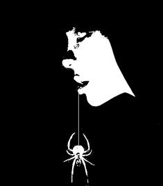 a black and white image of a spider hanging from a string with its mouth open