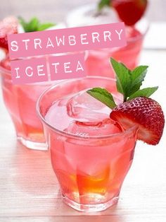 three glasses filled with pink lemonade and strawberries