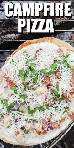 a pizza sitting on top of a grill covered in cheese