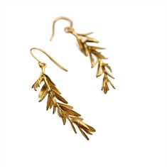 These rosemary leaf earrings are made from solid brass with some amazing detail. They feature a detailed sprig of tiny leaves, in a rich golden brass tone. The earrings measure 4.5cm (just less than two inches) long, and are designed to hang around jaw level. Yellow Gold Leaf-shaped Brass Earrings, Gold Nature-inspired Metal Earrings, Leaf-shaped Brass Earrings With Ear Wire, Nature-inspired Gold Earrings With Ear Wire, Gold Leaf Shaped Brass Jewelry, Nature-inspired Gold Earrings, Gold Leaf Nature-inspired Earrings, Nature-inspired Gold Leaf Earrings, Silk Purse