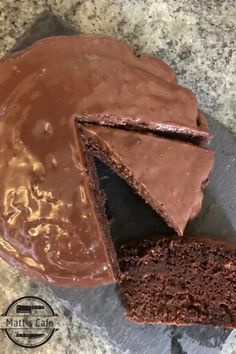 a chocolate cake with one slice missing from it