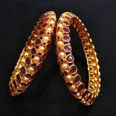 Ruby Kundan Kada / Reverse Polki Bangles / Ruby Pearl bangles / Indian Wedding Jewelry with semi-precious Ruby Stones @AryaFashions * Beautiful designer Gold tone Kundan bangles * Beautiful Jadau Bangle set with high quality Pearl and Meenakari work. * The base metal color is Gold tone studded with ruby accent semi precious stones on it. * Pair of two Bangles * Suitable for any occasion and attire * Comes in sizes 2.4,2.6 * Ready to ship from Virginia USA. Wedding Jeweled Bangle, Temple Jewelry Style Jeweled Bangle For Wedding, Temple Style Jeweled Bangle For Weddings, Jeweled Bracelets For Wedding And Diwali, Jeweled Bangle For Wedding And Diwali, Fusion Style Openable Bangle For Wedding, Jeweled Round Bangle For Wedding, Openable Round Jewelry For Wedding, Openable Round Wedding Jewelry