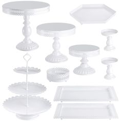 various white dishes and trays are shown in this image, including one with a cake stand