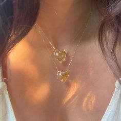 Beautiful AAA Large Citrine Heart Necklaces. 24k gold plated around the edges of the pendant so you can soak in the citrine energy through your skin Choose from 16 or 18 length! Chains are gold fill. Citrine attracts wealth, prosperity and success. It imparts joy, wonder, delight and enthusiasm. Raises self-esteem and self-confidence. Stimulates the brain, strengthening the intellect. Citrine promotes motivation, activates creativity and encourages self-expression Gold Pendant Heart Necklace With Gemstone, Gold Crystal Necklace With Heart Charm For Gifts, Spiritual Gold Crystal Necklace For Anniversary, Gold Dainty Crystal Necklace For Healing, Gold Citrine Pendant Crystal Necklace, Gold Citrine Necklace For Healing, Heart Gold Necklace, Heart Necklaces, Citrine Jewelry