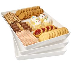 three trays filled with different types of cookies and crackers on top of each other