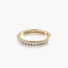 a yellow gold wedding band with five diamonds