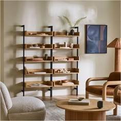 a living room filled with furniture and a book shelf