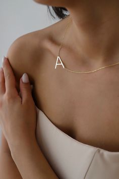 "Big letter necklaces are perfect for all outfits. It is so dainty, elegant and chic. Here you will find the super elegant initial necklace with us. You may design your alphabet necklace with any large letter you want. This sideways necklace will be a great silver gift idea for any women or mom. Big Letter form becoming really original and stylish. So you will have one of the most stylish gift in the world.  The gold name necklace is a durable solid necklace. First quality materials are used whi Minimalist Initial Pendant Name Necklace With Delicate Chain, Minimalist Initial Pendant Necklace As Gift For Her, Minimalist Letter Necklaces For Everyday, Minimalist Letter Charm Necklaces, Simple Initial Pendant Necklace With Clavicle Chain, Simple Initial Necklace With Clavicle Chain, Dainty Initial Necklace With Name, Minimalist Clavicle Chain Necklace With Initial Pendant, Minimalist Initial Pendant Name Necklace With Adjustable Chain