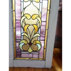 a stained glass door with an ornate design