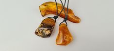 Welcome to my gemstone shop. I guarantee that all my items are handmade by me and made of genuine natural real Baltic Amber gemstone. Natural color yellow - brown Natural Baltic Amber.  Small amulets amber pendant.  It is raw amber with a natural shape.  This item is made of natural not heated not pressed amber.  Raw amber pendant.  Weight: ~ 3.0-5.0 gr.  Size: ~ 3.0-3.2 cm. (1.18-1.26 inch). Baltic Amber is a natural gemstone. Amber is surprisingly light: it will float in a saturated salt solution--but not in ordinary seawater.  This makes it suitable for large beads or pendants that are still comfortable to wear despite their size.  Amber comes in more colors than just yellow and golden.  It might also be white, yellow, and orange to reddish brown or even black.  This gemstone keeps good Handmade Yellow Baltic Amber Necklaces, Handmade Baltic Amber Necklace In Yellow, Handmade Yellow Baltic Amber Necklace, Handmade Baltic Amber Spiritual Necklace, Handmade Brown Baltic Amber Necklace, Handmade Baltic Amber Necklace In Brown, Spiritual Handmade Baltic Amber Necklaces, Handmade Baltic Amber Necklace In Spiritual Style, Spiritual Handmade Baltic Amber Necklace