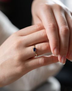 Mesmerizing deep blue sapphire set laterally, this brilliant celestial tone reminiscent of the night sky has been prized by jewellery lovers for centuries. Set here in a cast 14ct Yellow Gold ring, with 4 integral claws, other fine metals available. Sophisticated yet classic in design, this sapphire ring stands out from the crowd and would make the perfect engagement ring. A lavish gift for a September birthday. DEEP BLUE SAPPHIRE OVAL RING DETAILS Available in 9ct Yellow Gold, 14ct Yellow Gold, Timeless Sapphire Gemstone Ring As A Gift, Celestial Sapphire Birthstone Ring As Gift, Timeless Sapphire Birthstone Ring, Timeless Sapphire Ring With Birthstone, Timeless Sapphire Rings For Gifts, Oval Sapphire Birthstone Ring, Timeless Oval Sapphire Birthstone Ring, Oval Sapphire Diamond Ring As Gift, Celestial Blue Sapphire Promise Ring