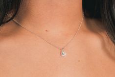 Tell your special someone how much they mean to you with this personalized sideways heart necklace. This sweet and dainty necklace features a tiny sideways heart charm that can be customized with a single initial or symbol of your choice. The necklace is crafted from sterling silver and hangs on a delicate chain. It's the perfect way to show your loved one how much they mean to you! MGJ's Engraved Disc Necklaces are custom-designed and expertly deep-engraved for lasting quality. This means that Dainty Silver Heart Pendant Initial Necklace, Silver Heart Pendant Initial Necklace In Sterling Silver, Silver Sterling Silver Heart Pendant Initial Necklace, Simple Sterling Silver Initial Pendant Charm Necklace, Delicate Sterling Silver Initial Necklace For Mother's Day, Delicate Sterling Silver Initial Necklace For Anniversary, Minimalist Sterling Silver Initial Necklace As Gift For Mom, Simple Personalized Sterling Silver Charm Necklace, Dainty Sterling Silver Name Necklace With Charms