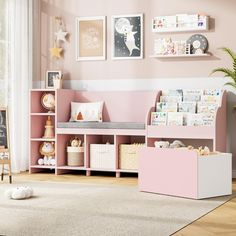 a child's room with pink and white furniture, bookshelves and toys