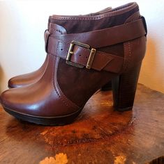 Elevate Your Fashion Game With These Stylish Clarks Lida Dallas Ankle Boots. The Sleek Brown Leather Upper And Buckle Feature Provide A Chic Equestrian Vibe That Is Perfect For Any Occasion, From Casual Outings To Parties. The High Block Heel Adds A Touch Of Sophistication, While The Leather Outsole Ensures Durability And Comfort. These Booties Are Available In Us Size 9 And Are Designed For Women Who Want To Make A Statement. The Fabric Lining And Insole Offer A Cozy And Breathable Experience, Making These Boots An Ideal Choice For All-Day Wear. Enjoy The Versatile Ankle Shaft Style That Pairs Perfectly With Any Outfit, From Skinny Jeans To Skirts. Update Your Shoe Collection With These F Ankle Brown Boots, Clark Boots, Clarks Originals Desert Boot, Leopard Print Ankle Boots, Clarks Boots, Black Leather Chelsea Boots, Fur Ankle Boots, Heeled Chelsea Boots