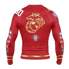 the back of a red long sleeved shirt with gold dragon on it