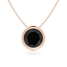 This classic solitaire black onyx pendant's beautiful design makes the splendid center stone appear like it's floating on the chain. The mysterious and captivating black onyx is secured in a bezel setting. Crafted in 14k rose gold, this round black onyx pendant makes a bold style statement. Black Onyx Pendant, Onyx Pendant, Natural Gemstone Jewelry, Solitaire Pendant, Yellow Gold Chain, Fine Jewellery Necklace, Bezel Setting, Black Onyx, Handcrafted Jewelry