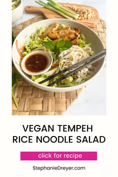 vegan tempeh rice noodle salad with chopsticks and sauce on the side