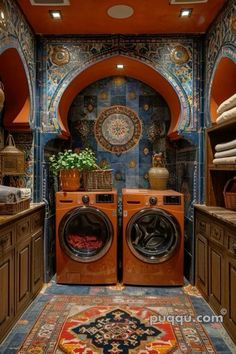 a washer and dryer are in the middle of a room with tile walls