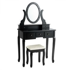 a black vanity table with mirror and stool