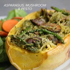 a close up of food on a plate near vegetables