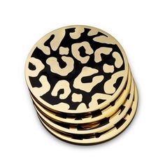 black and gold leopard print coasters stacked on top of each other