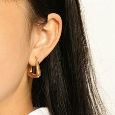 Embrace the modern simplicity of U Shape Earrings, expertly crafted in 18k gold plating. These earrings feature an elegant U-shaped design, offering a sleek and contemporary look. Gold Statement Earrings, Earrings Geometric, Waterproof Jewelry, Triangle Earrings, Gold Geometric, Keep Jewelry, Gold Hoops, Gold Plated Earrings, Stainless Steel Jewelry