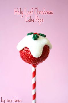 a strawberry covered in white frosting and sprinkles on top of a candy cane