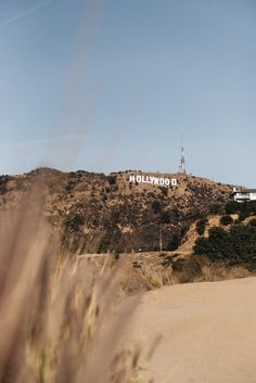 the hollywood sign is on top of a hill