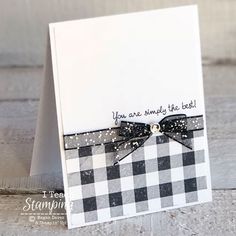 a close up of a card with a bow on it