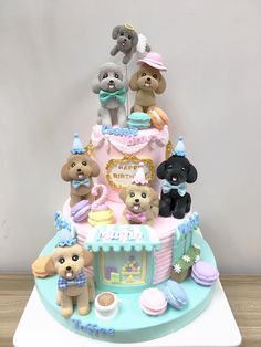 a birthday cake with dogs on top