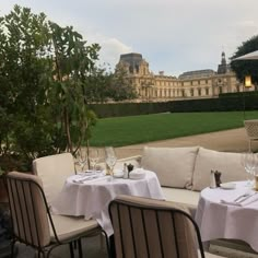 an outdoor dining area with tables and chairs